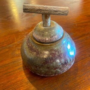 Handthrown pottery container with a lid with a wooden handle